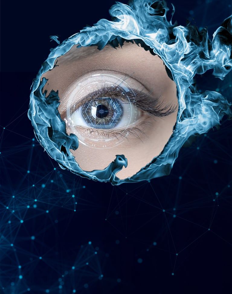Close-up of a blue eye framed by the Fenix Lumi phoenix swirl